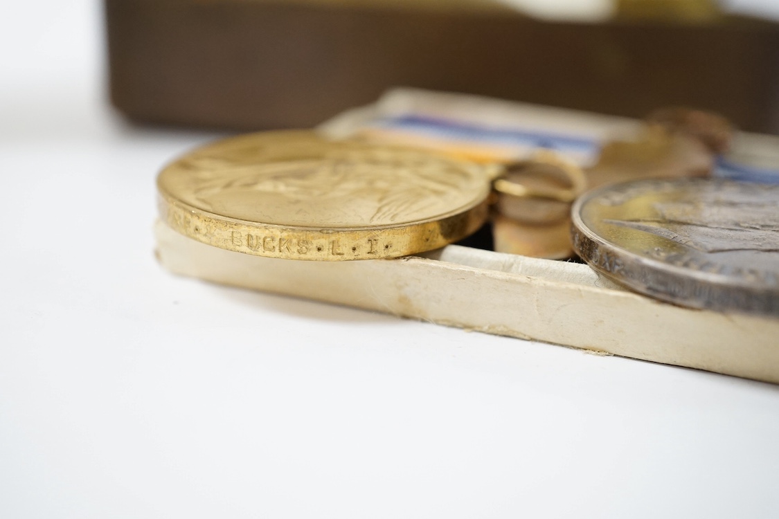 A posthumous First World War medal trio awarded to PTE. R. Holmes Oxf. & Bucks. L.I., together with the issuing letter, the remains of the original card box and a Princess Mary Christmas tin. Condition - fair.